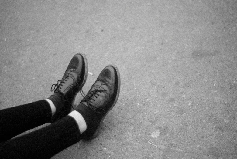 a black and white photo of a pair of shoes, inspired by Vivian Maier, unsplash, postminimalism, creepers, socks, wearing black, photo pinterest