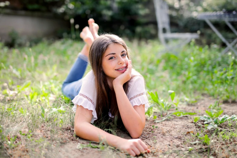 a girl laying on the ground in the grass, a picture, avatar image, professional image, 15081959 21121991 01012000 4k, full body! pretty face