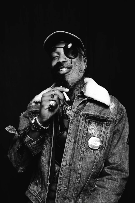 a black and white photo of a man smoking a cigarette, an album cover, by Charles Martin, wearing a bandana and chain, some wrinkled, tie-dye, exactly 5 fingers