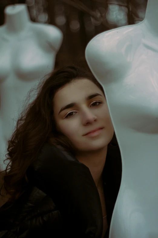 a woman sitting next to a white mannequin, a marble sculpture, by irakli nadar, pexels contest winner, halfbody headshot, beautiful boy, still from a music video, girl with black hair