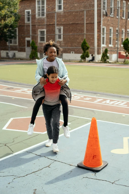 a woman carrying a child across a basketball court, happening, at netflix, schools, diverse, promo photo