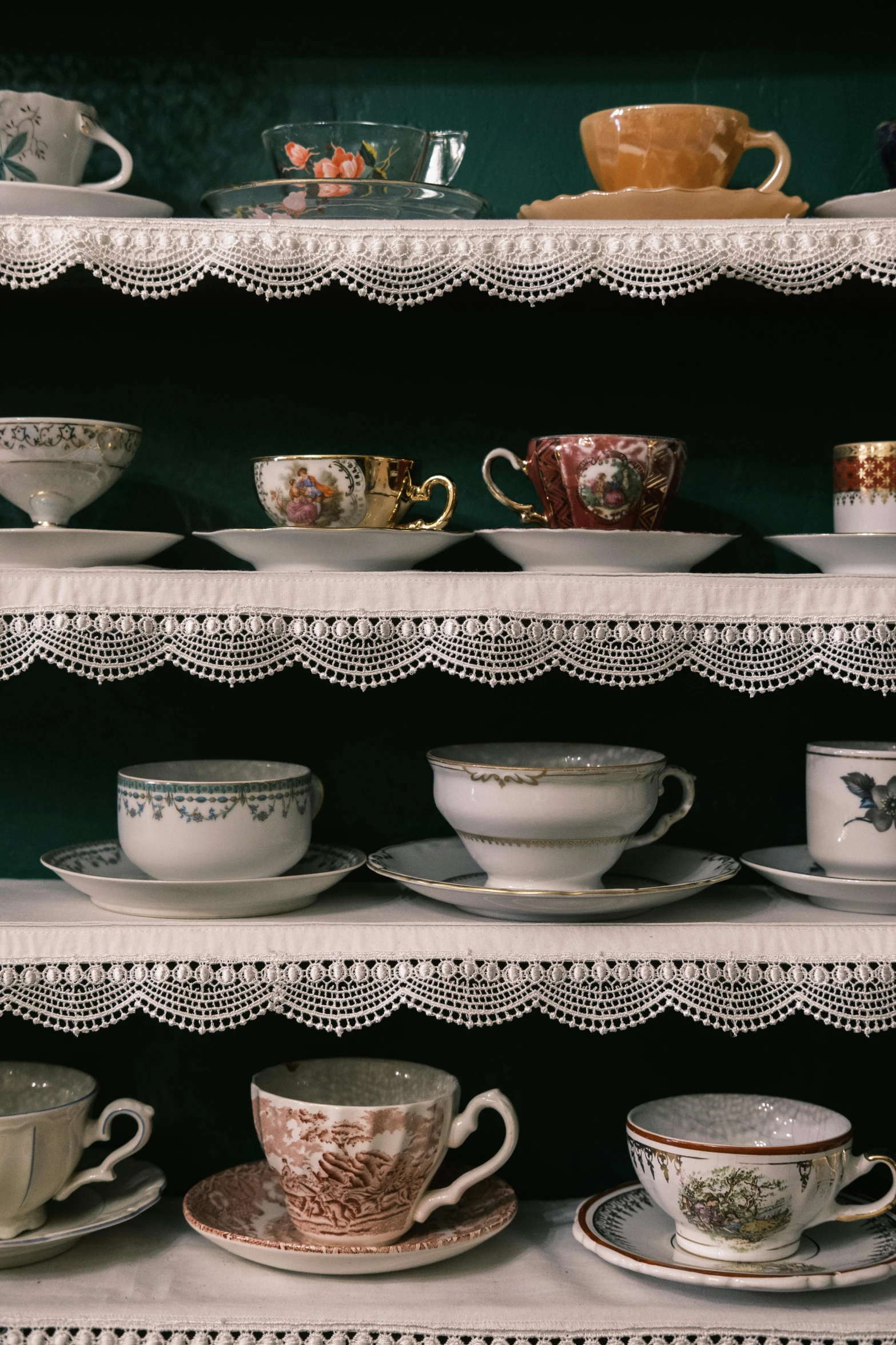 a shelf filled with lots of cups and saucers, a cross stitch, by Elsa Bleda, unsplash, victorian lace, 19th-century, made of glazed, dynamic closeup