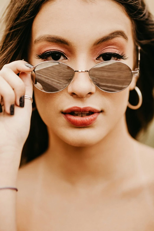 a close up of a person holding a pair of sunglasses, beautiful oval face, silver and muted colors, 5 0 0 px models, teenage girl