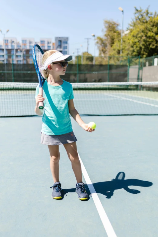 a little girl standing on top of a tennis court holding a racquet, wearing sunglasses and a cap, vanilla, oceanside, thumbnail