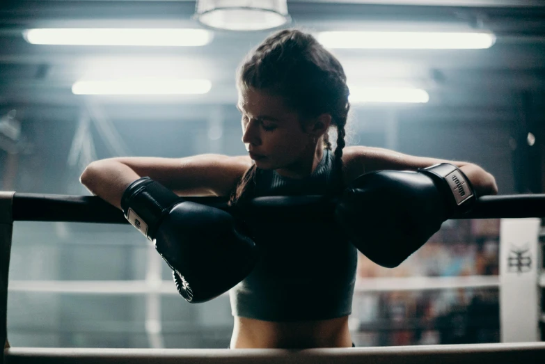 a woman wearing boxing gloves in a boxing ring, pexels contest winner, manuka, thrusters, lean and toned, ellie victoria gale