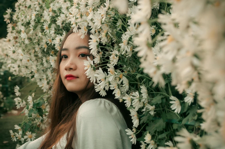 a woman standing in front of a bunch of flowers, by Tan Ting-pho, pexels contest winner, aestheticism, her face is coated in a white, half asian, white flowers, asian girl with long hair