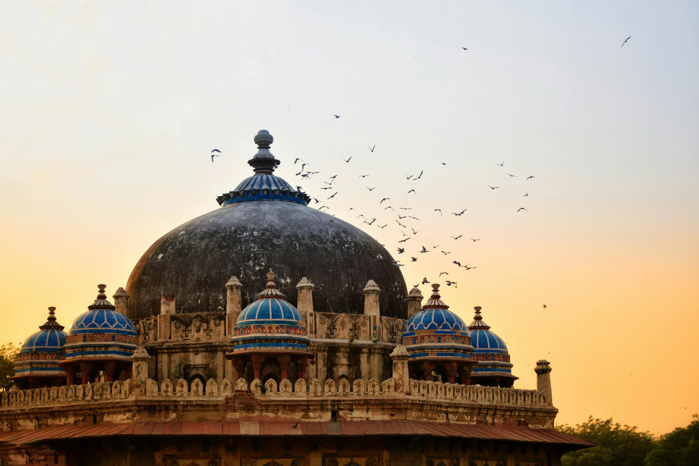 a building with a lot of birds flying around it, pexels contest winner, baroque, ancient india, geodesic domes, tomb, promo image