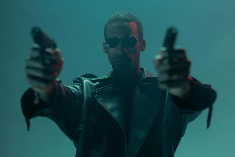 a man in a leather jacket holding two guns, inspired by Zhu Da, pexels, a teen black cyborg, film still, underworld, sunglasses on