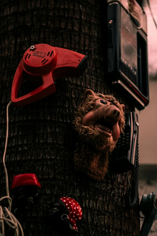 a close up of a telephone on a tree, by Filip Hodas, portrait of freddy fazbear, crimson themed, ((trees)), saws