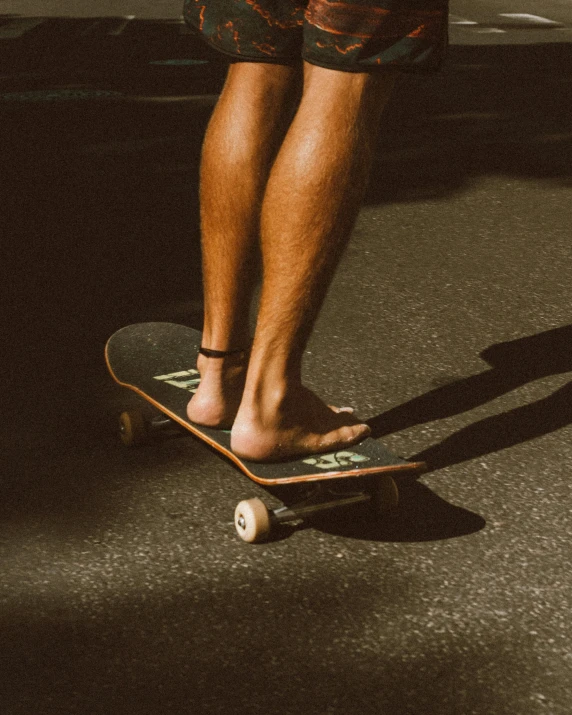 a man standing on a skateboard in a parking lot, trending on unsplash, barefoot in sandals, lgbt, background image, leaked photo