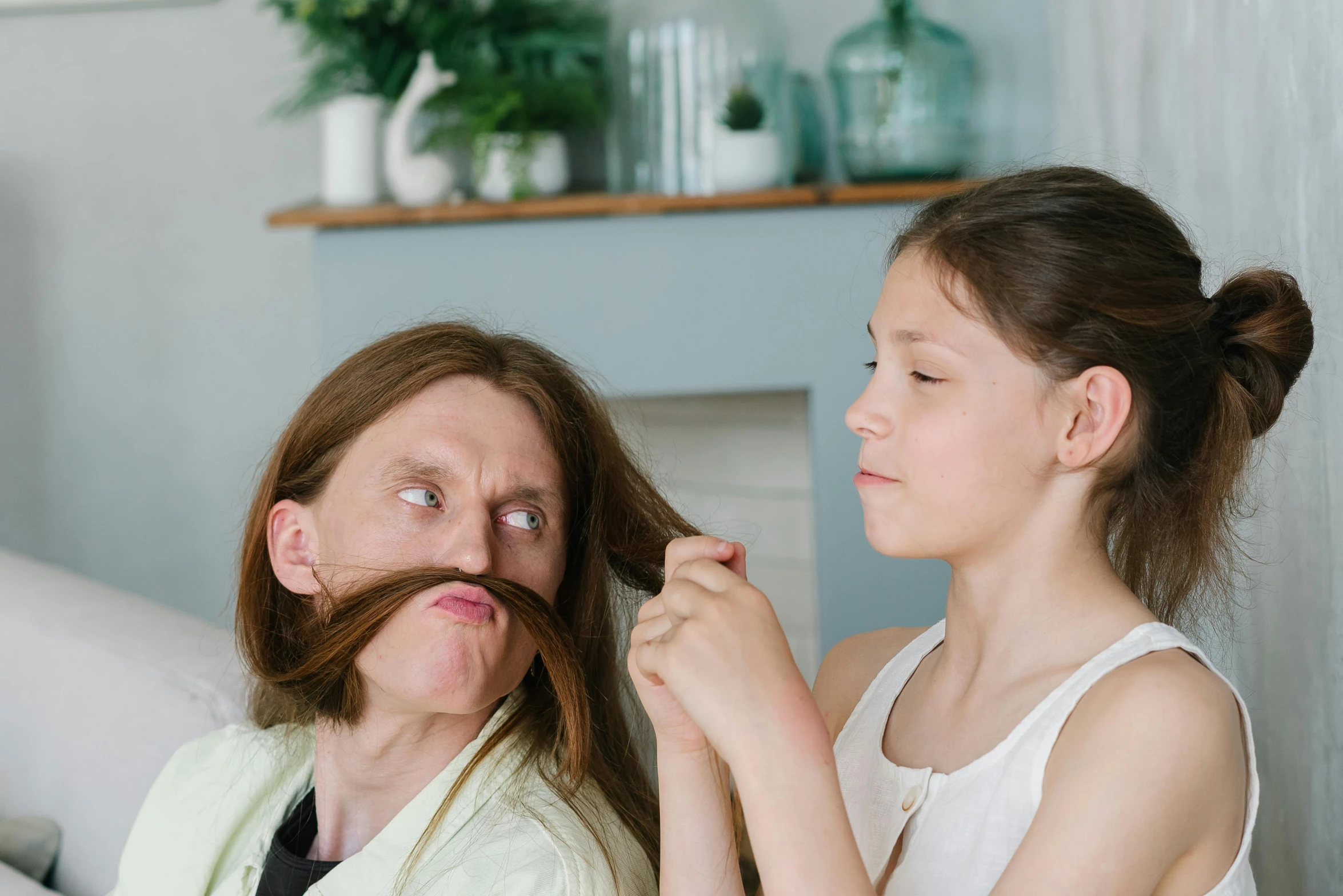 a woman combing another woman's hair in a living room, inspired by Frieke Janssens, trending on pexels, oldman with mustach, avatar image, silly face, child hybrid