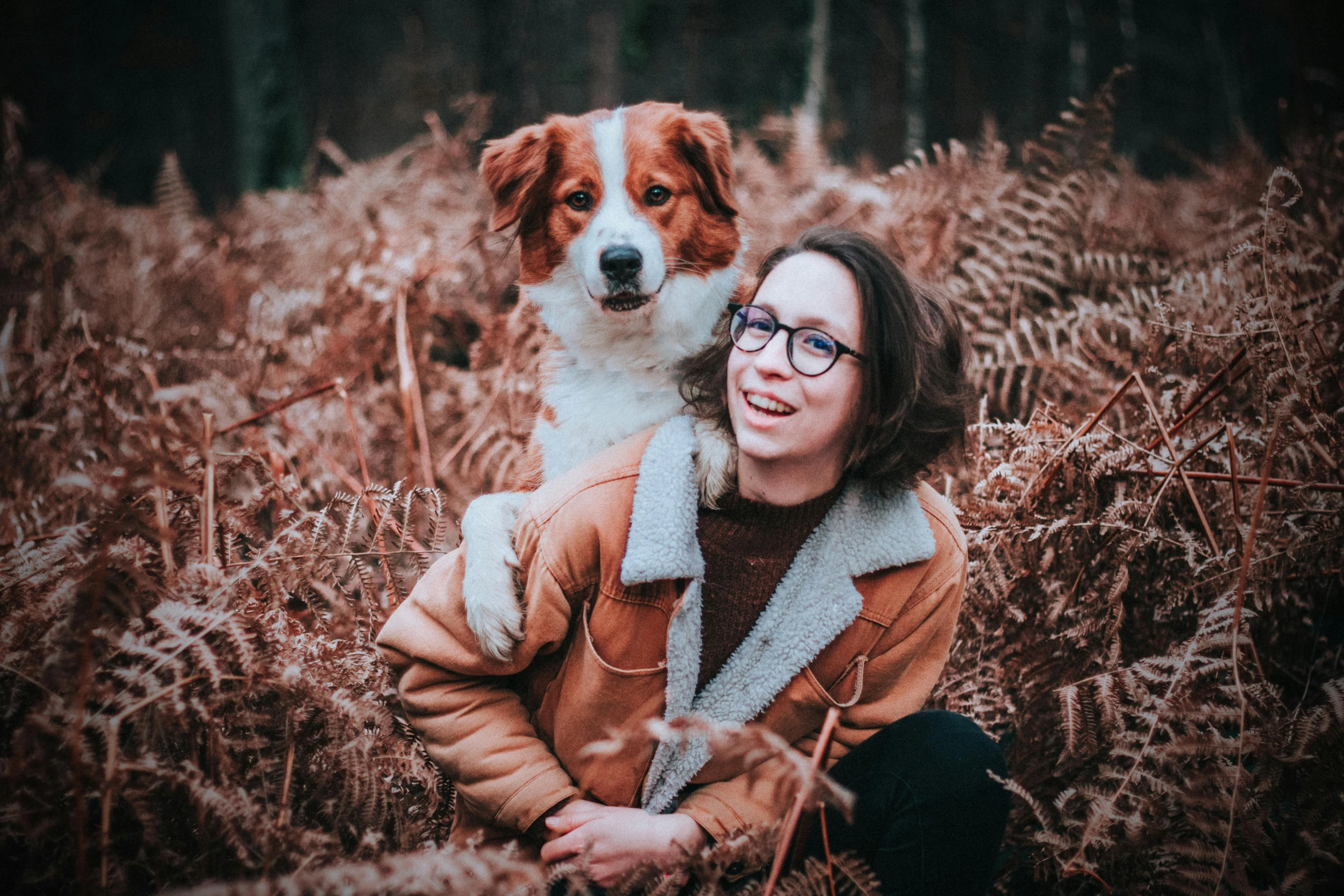 a woman sitting in a field with a dog, a portrait, by Emma Andijewska, pexels contest winner, avatar image, ( redhead, portrait of max caulfield, instagram post