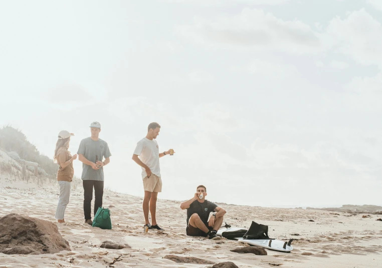 a group of people standing on top of a sandy beach, a picture, by Lee Loughridge, unsplash contest winner, happening, aussie baristas, having a picnic, videogame still, film still dnd