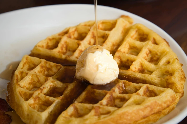 a white plate topped with waffles covered in syrup, pexels contest winner, hurufiyya, butter, daily specials, thumbnail, closeup shot