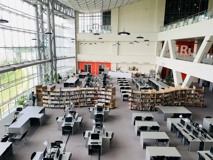 a library filled with lots of desks and computers, a portrait, reddit, academic art, floor - to - ceiling windows, espoo, thumbnail, high ceilings