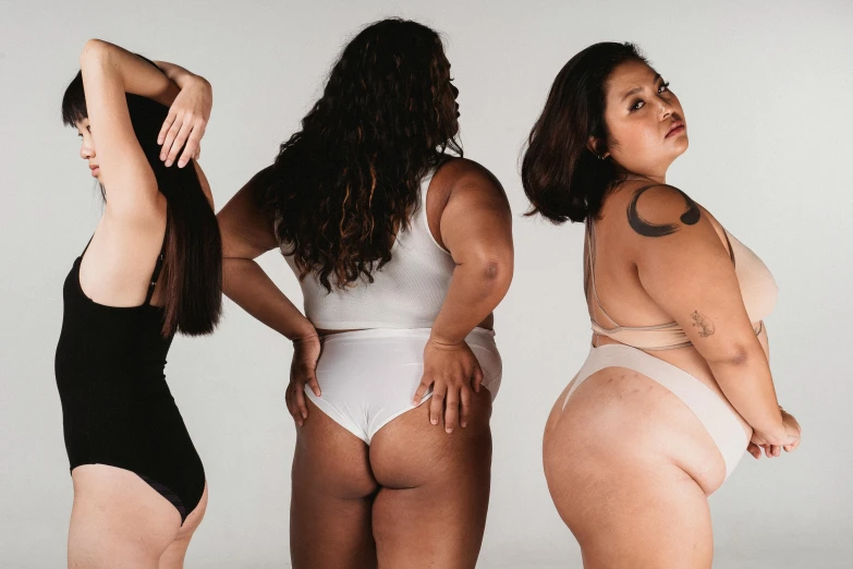 a group of women standing next to each other, inspired by Vanessa Beecroft, trending on pexels, renaissance, curvy accentuated booty, three women, creamy skin, circle