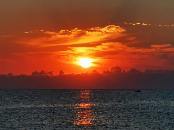 the sun is setting over a body of water, a picture, by Robbie Trevino, pexels contest winner, okinawa japan, sky on fire, no cropping, horizon