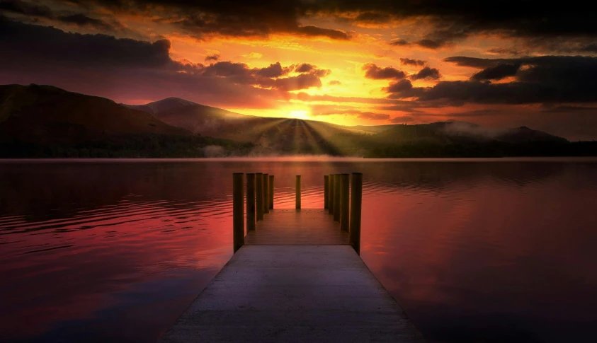 a dock in the middle of a lake at sunset, inspired by Frederic Edwin Church, pexels contest winner, hudson river school, marc adamus, dramatic light 8 k, photoreal”, new hampshire