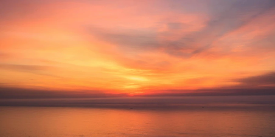 a large body of water with a sunset in the background, pexels contest winner, romanticism, gradient orange, seaview, pink hues, good morning