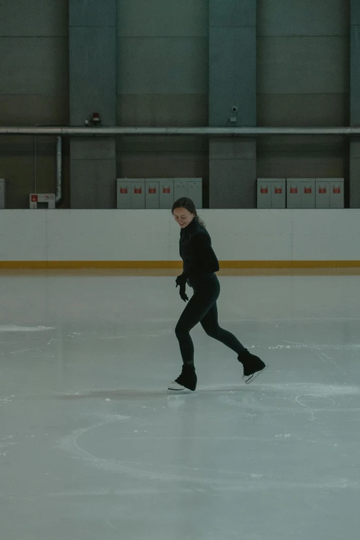 a woman is skating on an ice rink, inspired by Zhou Wenjing, anamorphic cinematography, pose 4 of 1 6, wenjun lin, vine