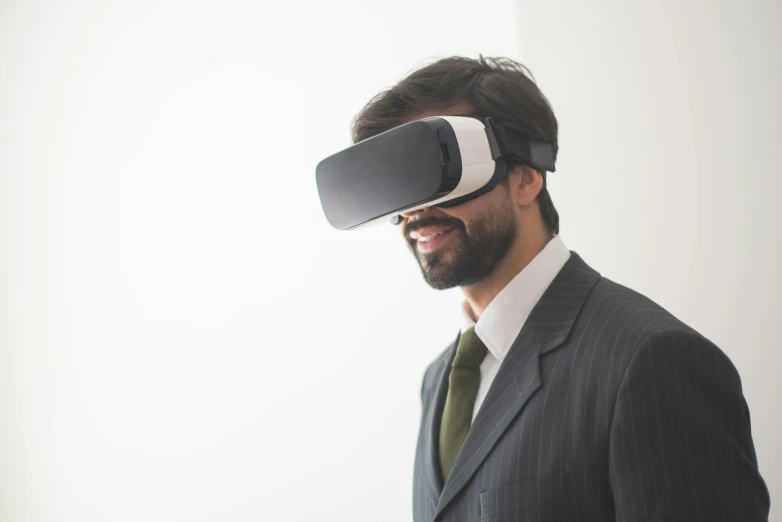 a man in a suit wearing a virtual reality headset, unsplash, avatar image, glass visor, cardboard, ultra-realism