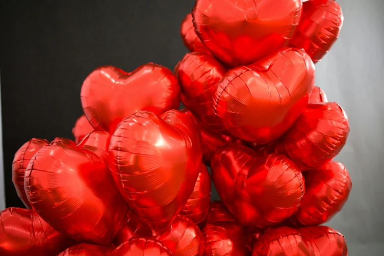 a bunch of red heart shaped balloons, by Julia Pishtar, metallic, thumbnail, high, seasonal