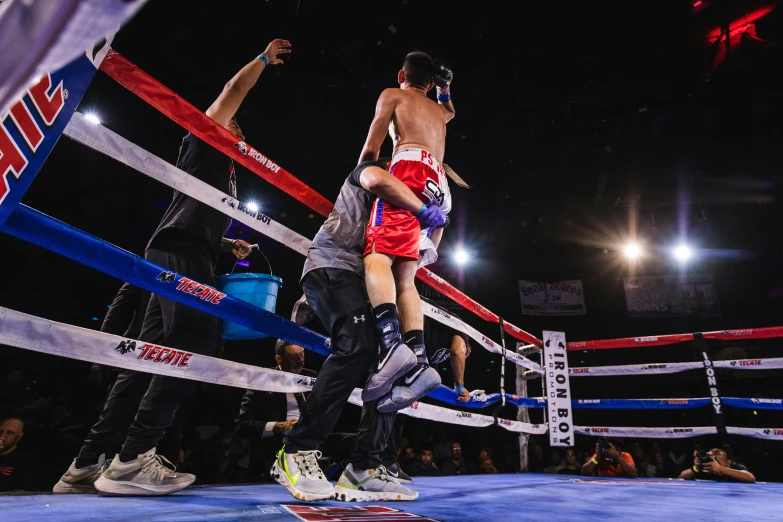 a couple of men standing next to each other in a boxing ring, by Robbie Trevino, pexels contest winner, little kid, photo finish, celebrating, 15081959 21121991 01012000 4k