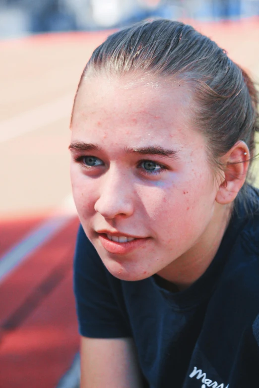 a young girl holding a tennis racquet on a tennis court, a portrait, unsplash, a plaster on her cheek, wearing track and field suit, slightly pixelated, concerned
