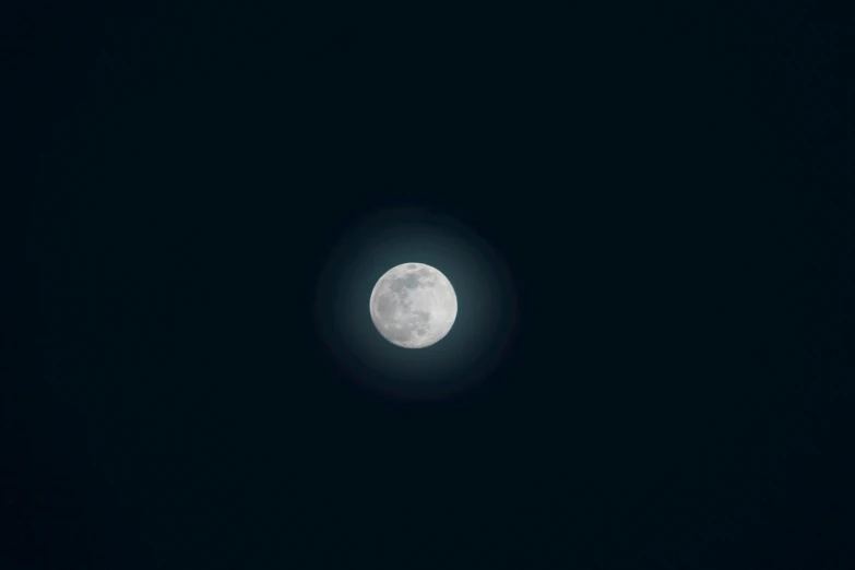 the moon is shining brightly in the dark sky, an album cover, pexels, minimalism, ☁🌪🌙👩🏾, atmospheric full moon, silver, phosphorescent