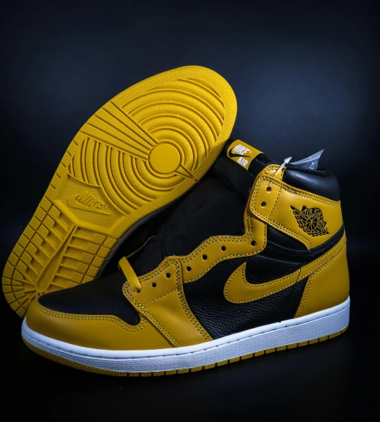 a pair of yellow and black sneakers on a black background, inspired by Yang J, hurufiyya, “air jordan 1, extremely detailed frontal angle, high contras, modded