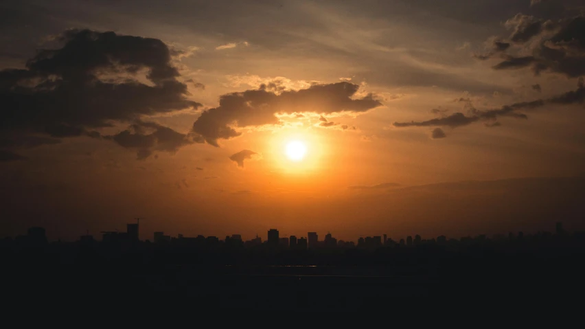 the sun is setting over the city skyline, pexels contest winner, hot and humid, instagram post, sun shafts, wide