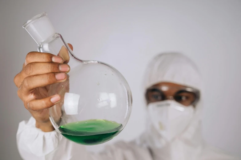 a man holding a flask filled with green liquid, pexels contest winner, analytical art, staff wearing hazmat suits, green and purple, clean white lab background, an scp anomalous object