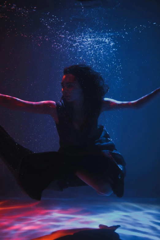 a woman that is jumping in the air, an album cover, unsplash, conceptual art, aqua volumetric lights, frank dillane as puck, tessa thompson, wet look