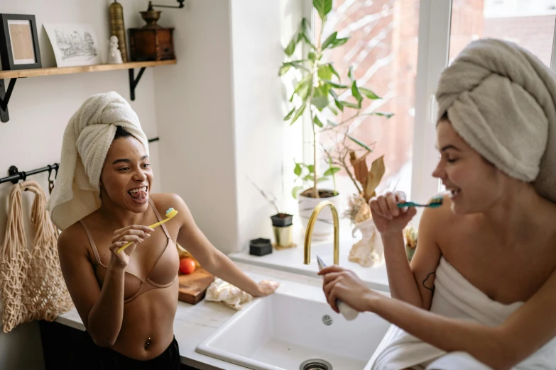 two women brushing their teeth in a bathroom, by Emma Andijewska, trending on pexels, happening, super sexy, with a straw, charli bowater and artgeem, joyful people in the house