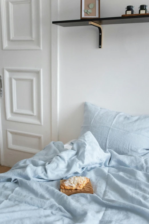 a bed room with a neatly made bed, by Nina Hamnett, trending on unsplash, baroque, soft blue light, bread, square, hemp