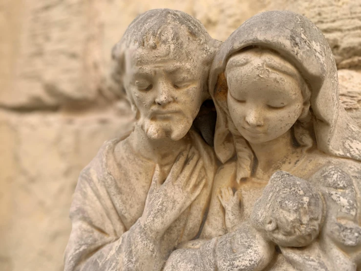 a statue of a man and a woman holding a baby, a statue, inspired by Károly Markó the Elder, pexels contest winner, renaissance, jesus of nazareth, made of stone and concrete, clay model, pristine and clean