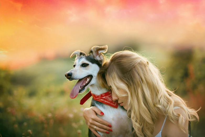 a woman is hugging a dog in a field, inspired by Elke Vogelsang, pixabay, romanticism, avatar image, soft grey and red natural light, multicoloured, aussie