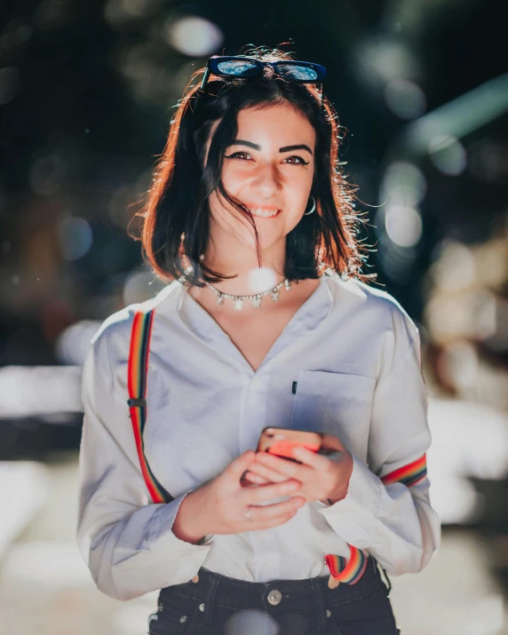 a woman with a cigarette in her mouth, trending on pexels, happening, cute slightly nerdy smile, beautiful iranian woman, outfit photo, she is holding a smartphone