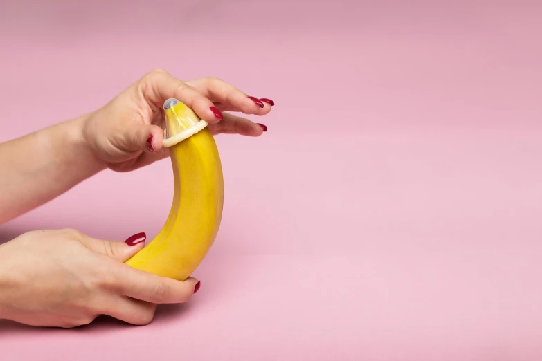 a close up of a person holding a banana, inspired by Sarah Lucas, cervix awakening, french kiss, vibrating, d-cup