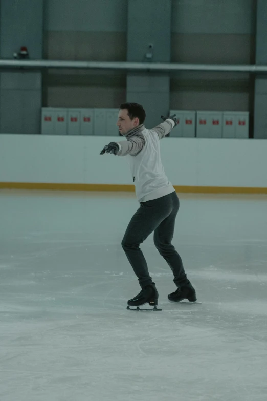 a man riding a skateboard on top of an ice rink, a hologram, inspired by Daniël Mijtens, arabesque, simon stalberg, still frame, up to the elbow, promo image