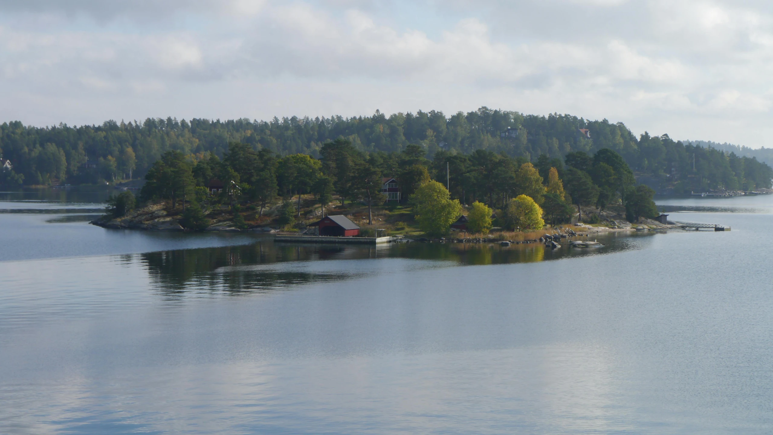 a small island in the middle of a body of water, a picture, inspired by Wilhelm Marstrand, pexels contest winner, hurufiyya, alvar aalto, avatar image, no cropping, beginning of autumn