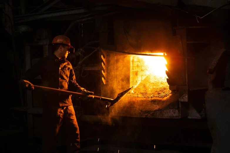 a man that is standing in front of a fire, steel mill, worksafe. instagram photo, getty images, made in bronze