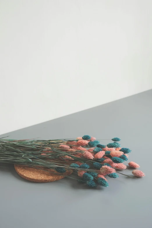 a bunch of flowers sitting on top of a table, a colorized photo, inspired by Elsa Bleda, unsplash, visual art, made of beads and yarn, minimalist photorealist, pink and teal and orange, thistles