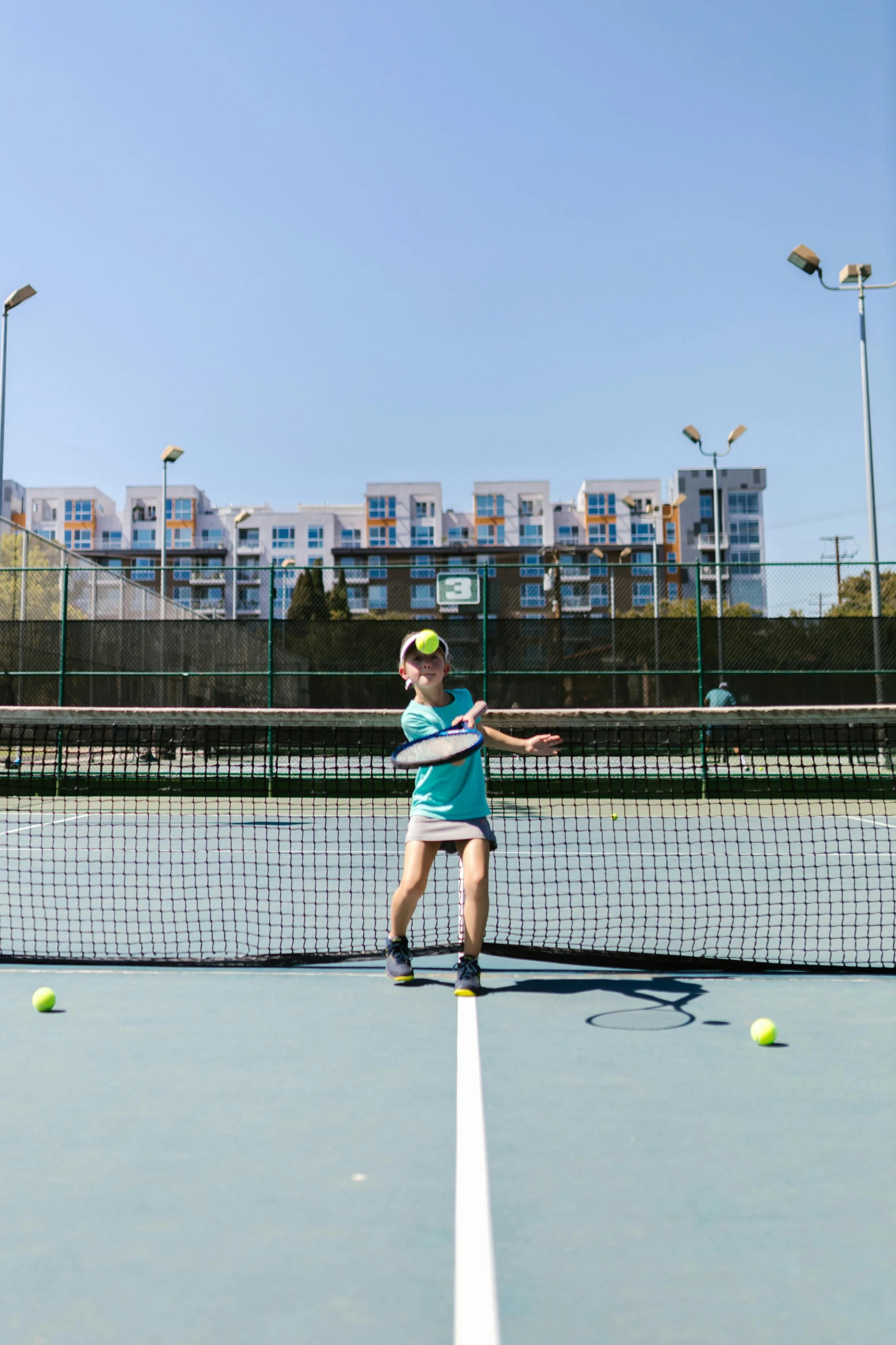 a woman standing on a tennis court holding a racquet, unsplash, happening, panoramic view of girl, square, taken with sony alpha 9, apartments