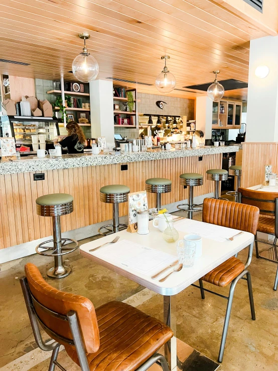 a restaurant filled with lots of tables and chairs, wearing rr diner uniform, white background and fill, thumbnail, vintage vibe