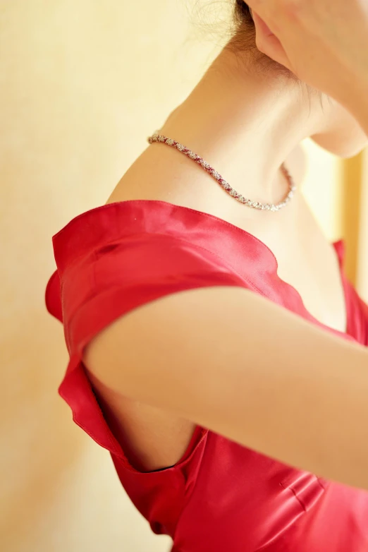 a woman in a red dress combing her hair, by Miyamoto, over the shoulder closeup, silver necklace, van cleef & arpels, 15081959 21121991 01012000 4k