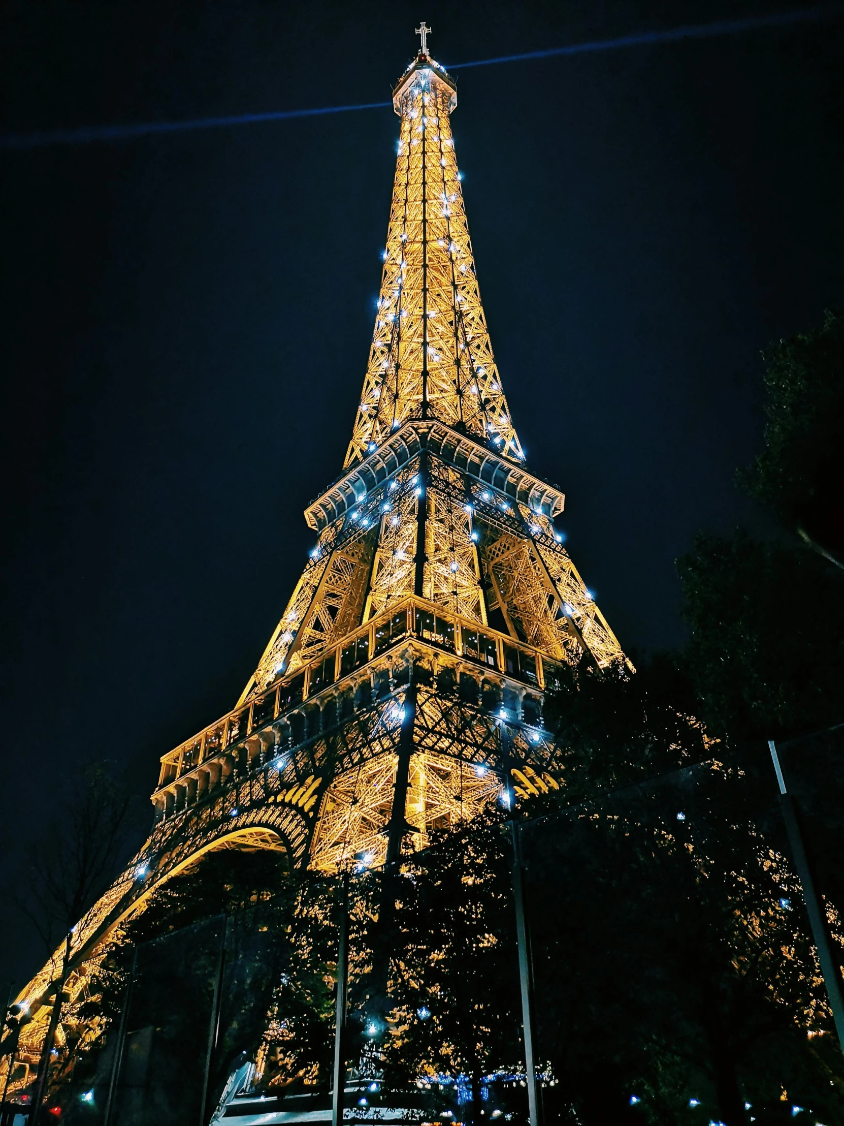 the eiffel tower is lit up at night, a photo, pexels contest winner, close up shot from the side, high detail photo, 8k resolution”, instagram story