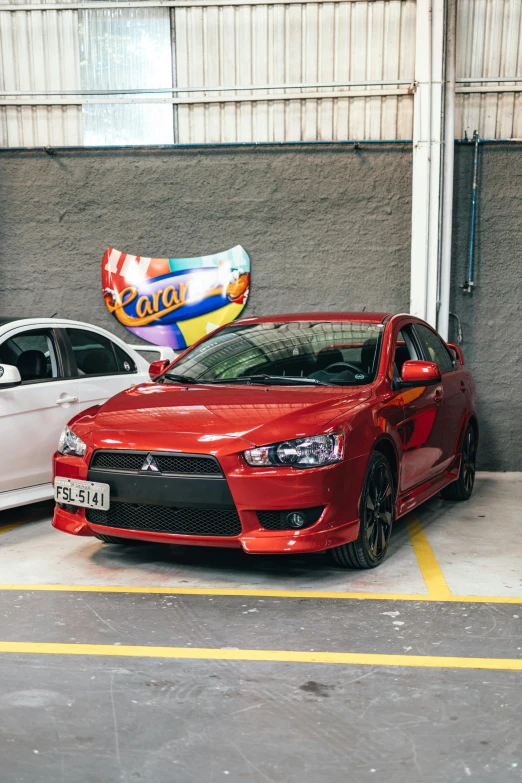 a couple of cars parked next to each other, pexels contest winner, toyism, são paulo, low quality photo, the red ninja, indoor picture