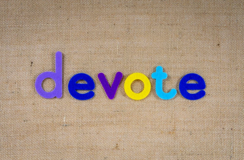 the word devote spelled in colorful plastic letters, by Matt Cavotta, trending on pexels, purple drapery, election poster, mobile learning app prototype, poster template on canva
