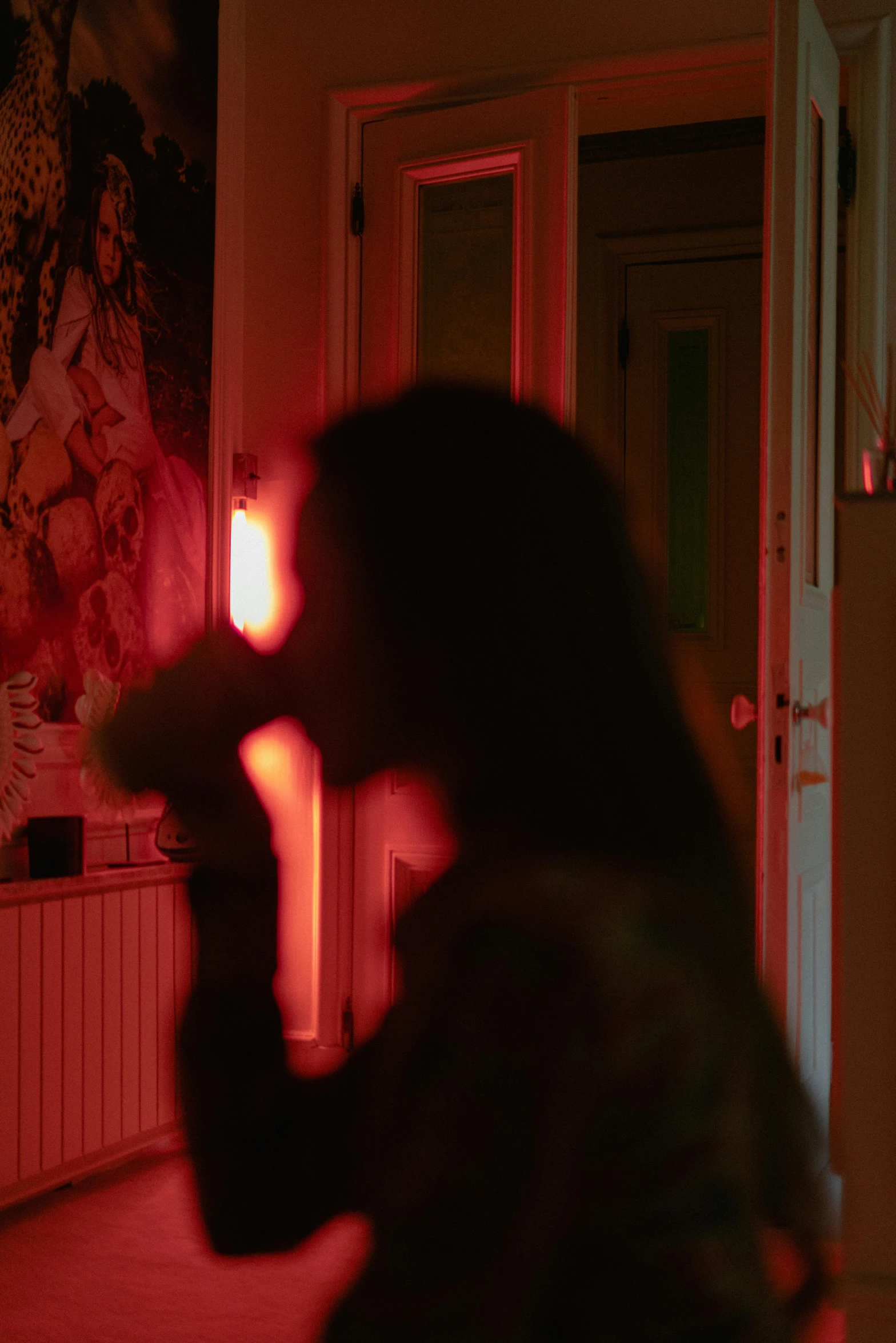 a woman blow drying her hair in a dark room, inspired by Nan Goldin, red illuminating fog, reylo kissing, brightly lit pink room, still frame from a movie